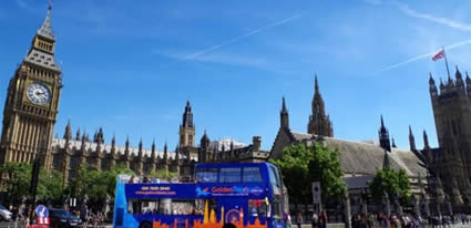 golden tours bus in front of big ben