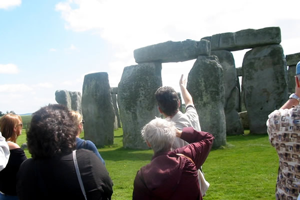 Guide at Stonehenge leading tour