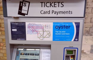 Purchasing tickets at Paddington Railway Station, London