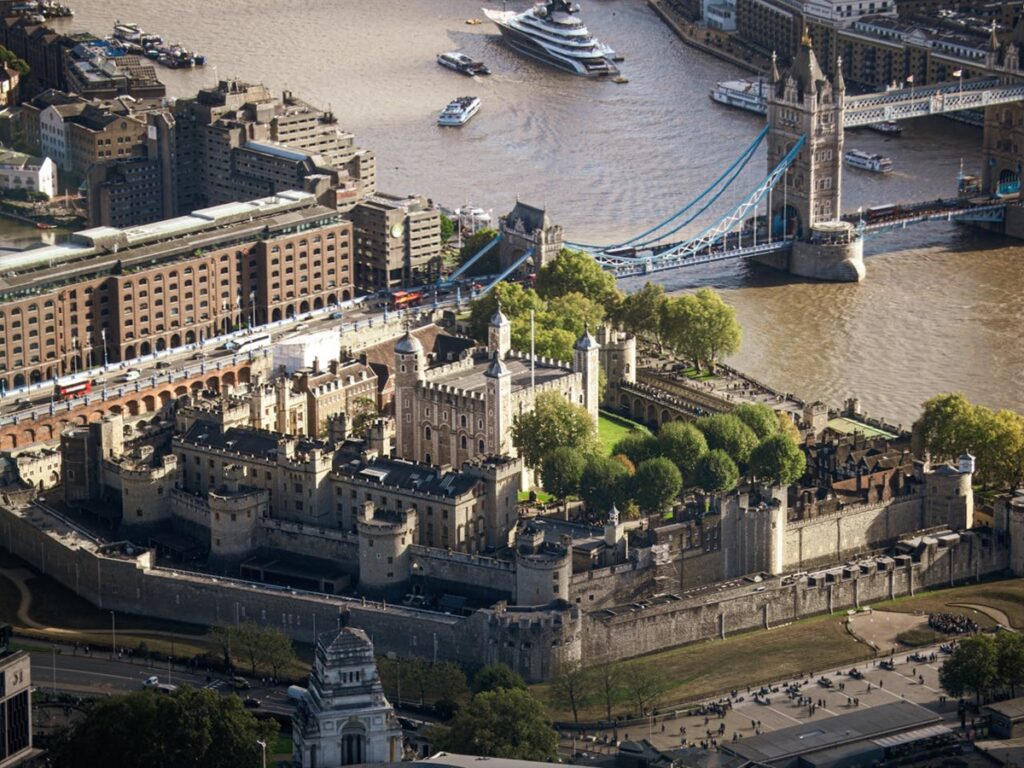 Aerial view of the Tower of London with Tower Bridge in the background