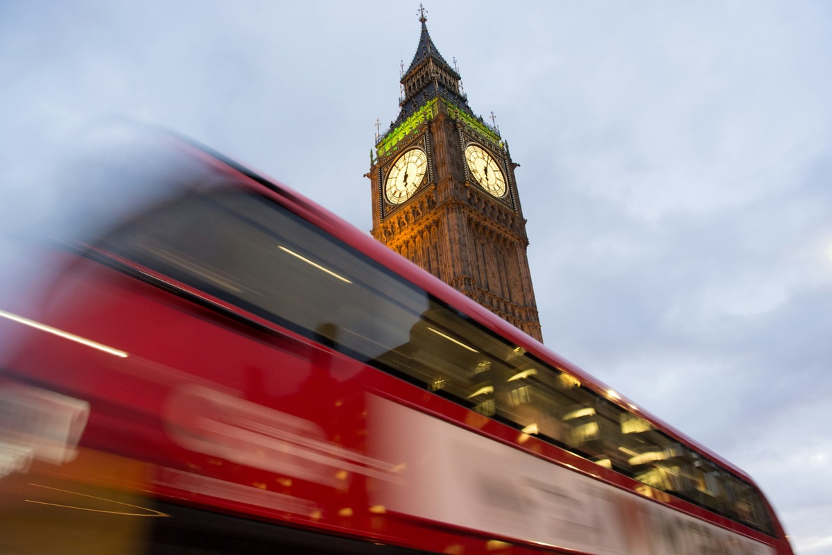Iconic Red London bus with Big Ben in the background