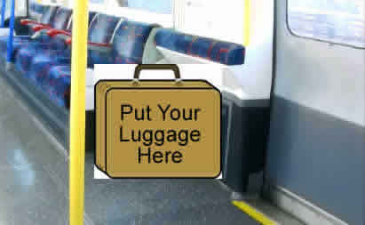 View through carriage of Piccadilly tube train showing luggage area