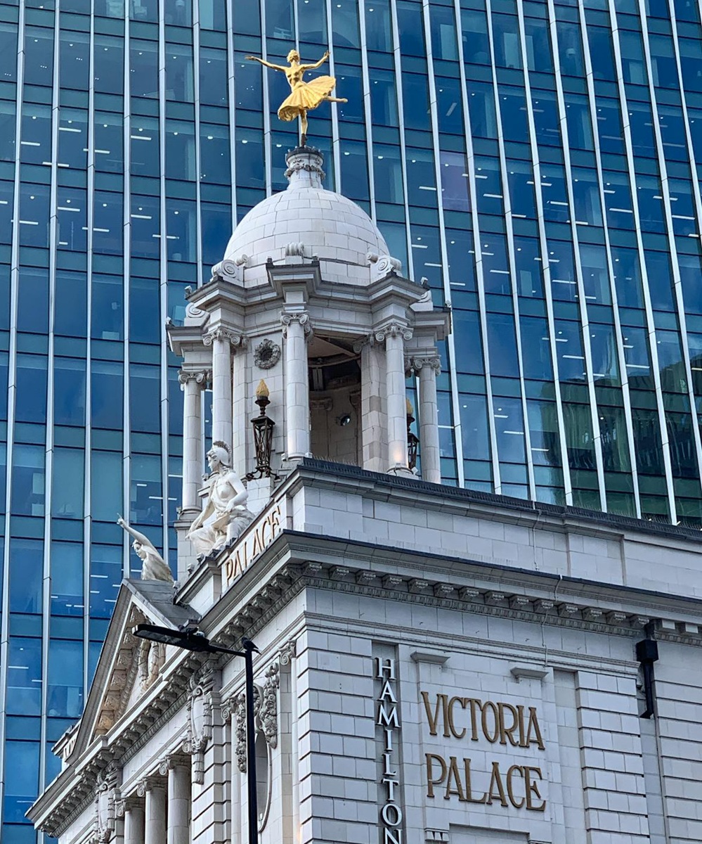 Victoria Palace with skyscraper in background