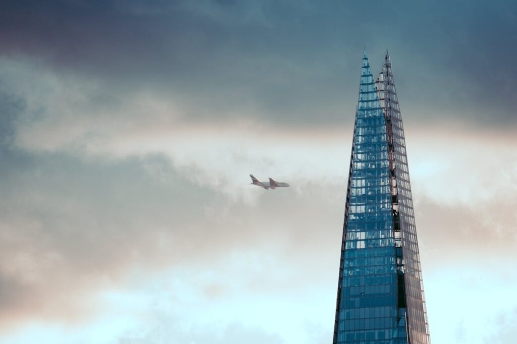 The Shard with an aircraft flying in the distance