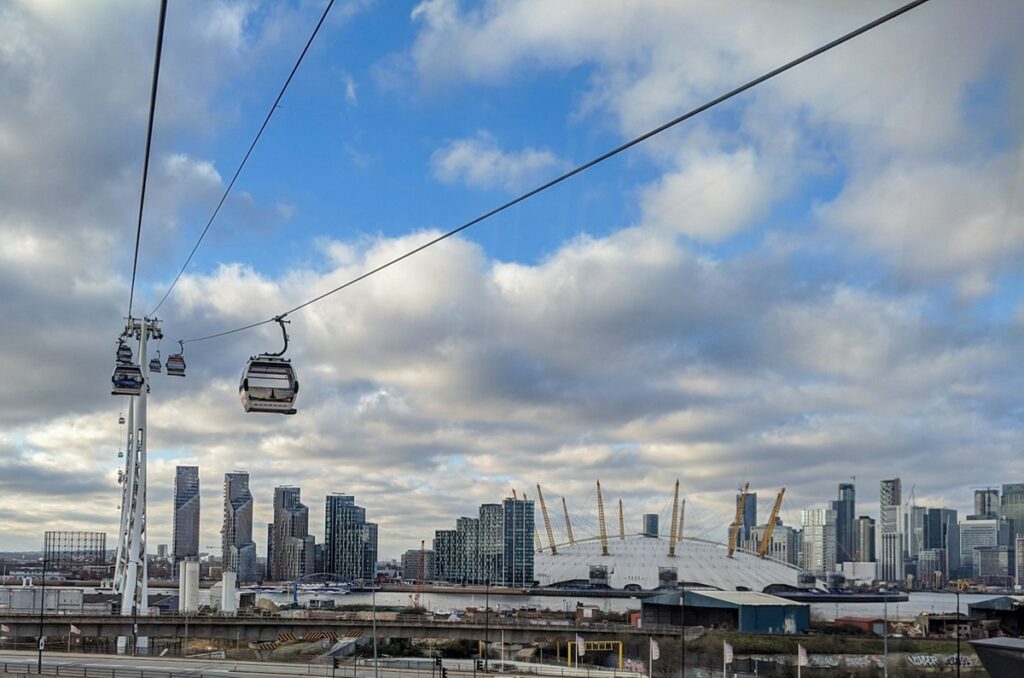 Cable cars with O2 Arena in the background