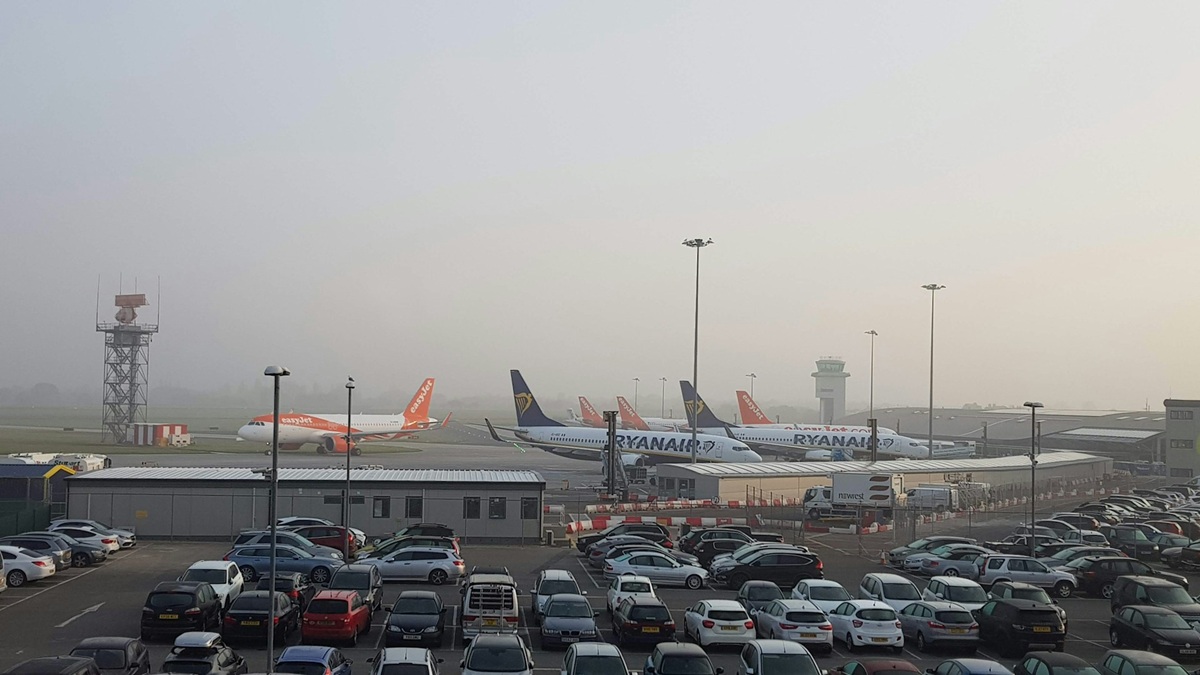 View from the Holiday Inn Hotel over a foggy runway and carpark at Southend Airport