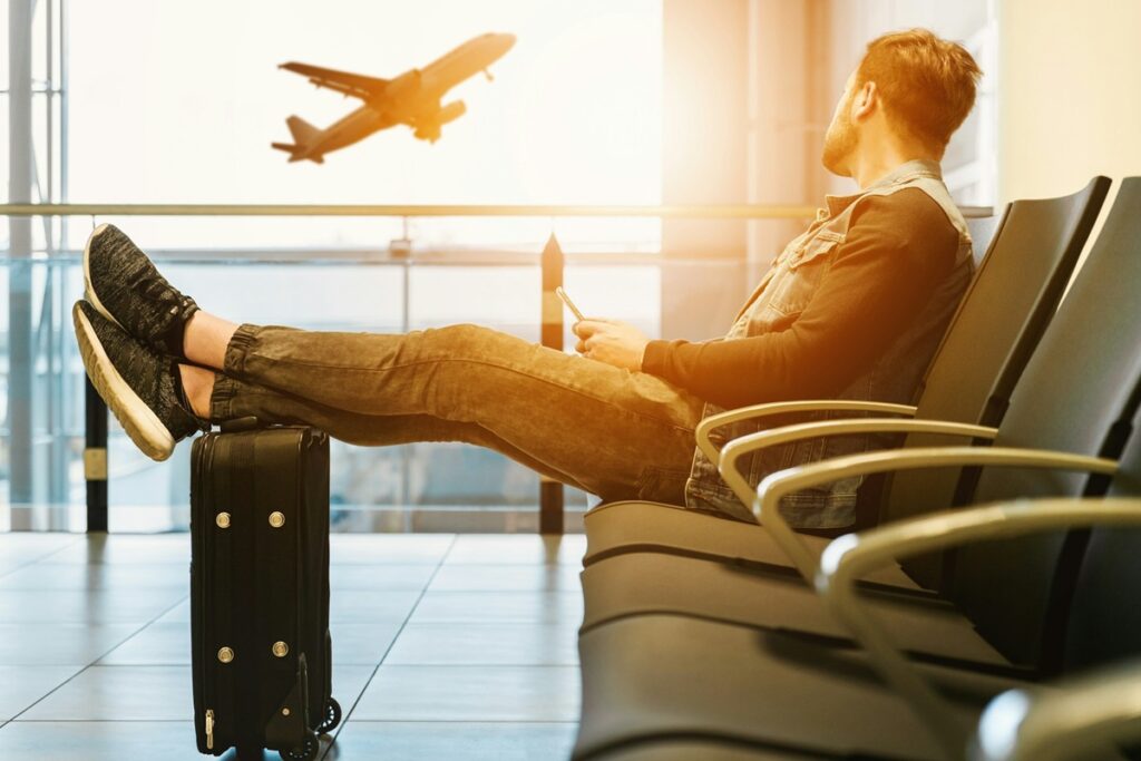 View of aircraft taking off from airport lounge
