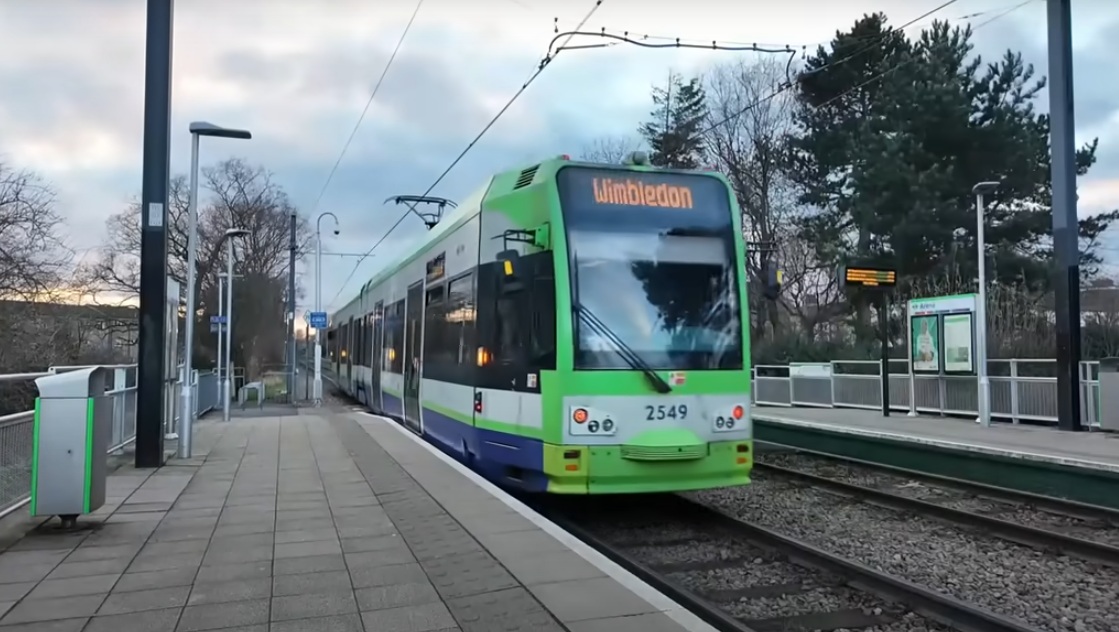 London tram passing through station