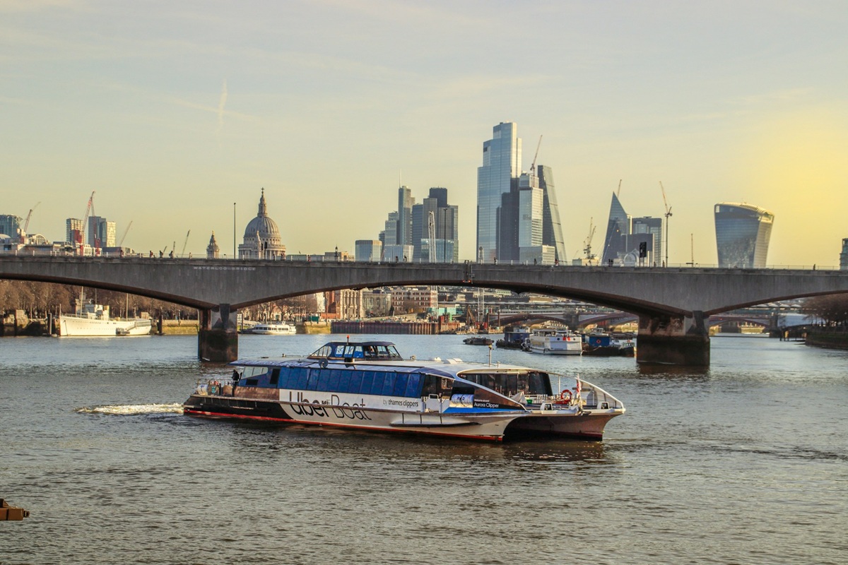 Uber Boat with London City background