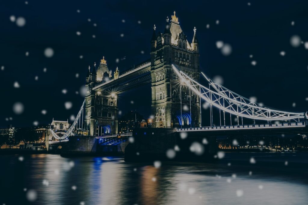 London Bridge at night with snowflakes