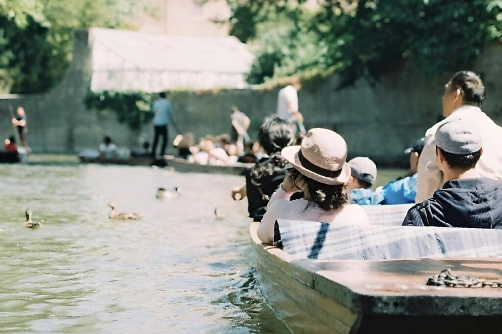 People enjoying a punt ride along the river